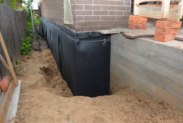 SJ Waterproofing Pros technician performing targeted Waterproofing assessment in Jonesboro, IN